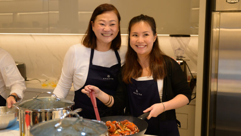 Tourists cooking Singapore dishes