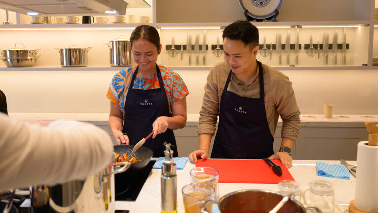Tourists cooking Singapore dishes